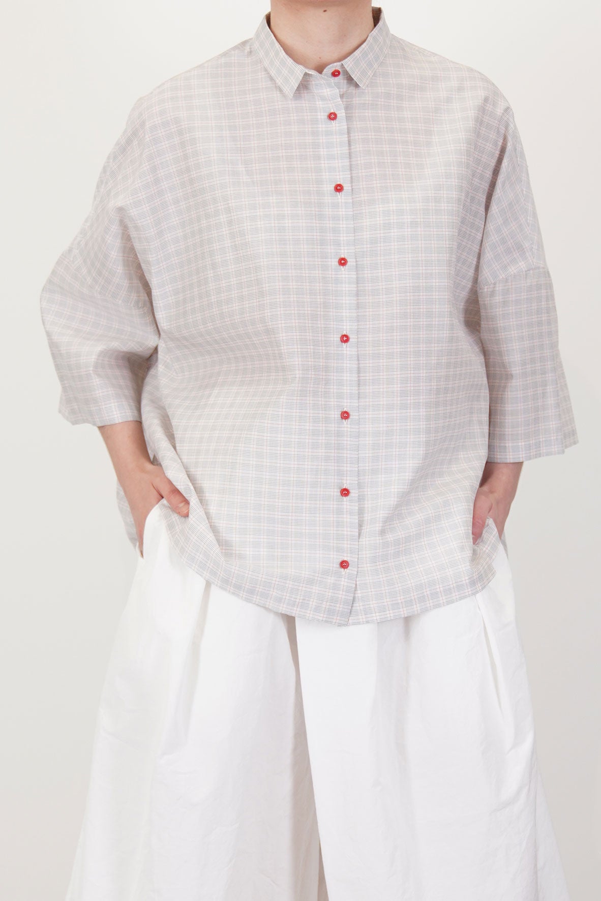 detail front view of apuntob (a.b) shirt check cotton silk tomato contrast hued front button opening and shirt collar detail