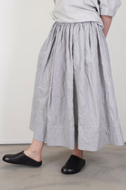 front view of apuntob (a.b) skirt fine stripes abyss delicate and minimlaist design