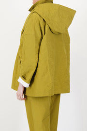 back view of apuntob (a.b) jacket oil drop shoulders and generous cut
