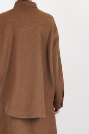 back detail view of asciari shirt cruz wool cashmere brown curved longer back hemline and soft wool material.
