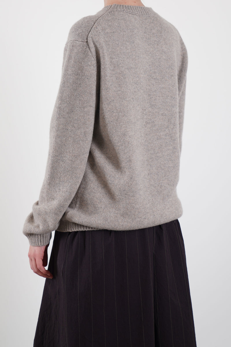 back view of bergfabel cashmere pullover greige relaxed, loose silhouette with drop shoulder design and detailed ribbing for added texture.