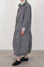 side view of bergfabel virgin wool uli jacket check, cotton lined sleeve detail and worn with matching carla skirt check