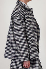 side detail view of bergfabel virgin wool uli jacket check drop shoulders and side pocket