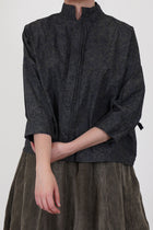 detail view of bergfabel claudia shirt dark flowers "tyrol pleats" at the front button opening