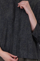 detail view of bergfabel claudia shirt dark flowers front button opening and pleat details