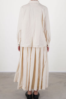 back view of bergfabel matilde skirt off-white relaxed and effortless fit worn with matching jenny shirt off-white