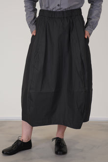 detail view of bergfabel coated cotton carla skirt carbon crafted in a lightweight and unlined coated cotton fabric