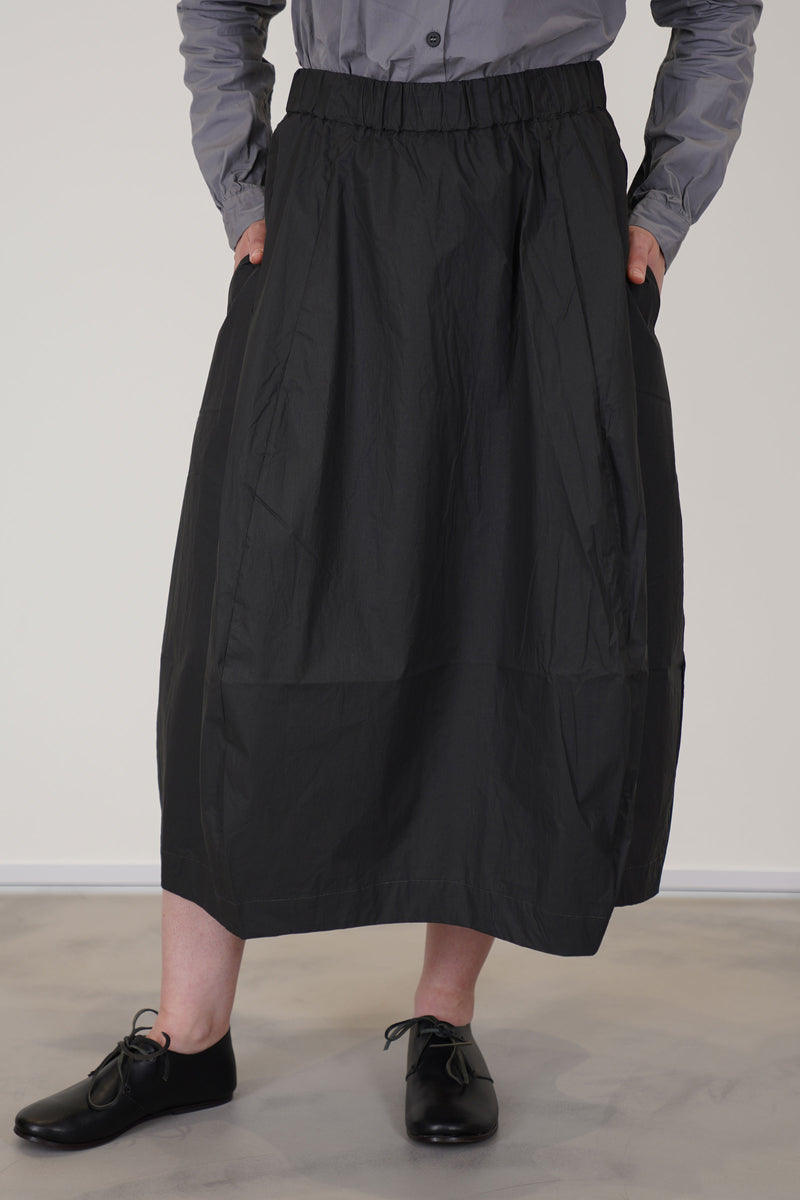 detail view of bergfabel coated cotton carla skirt carbon crafted in a lightweight and unlined coated cotton fabric