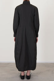back view of bergfabel letty dress moss long sleeve dress with a stand collar detail, midi length and long sleeves with a button detail