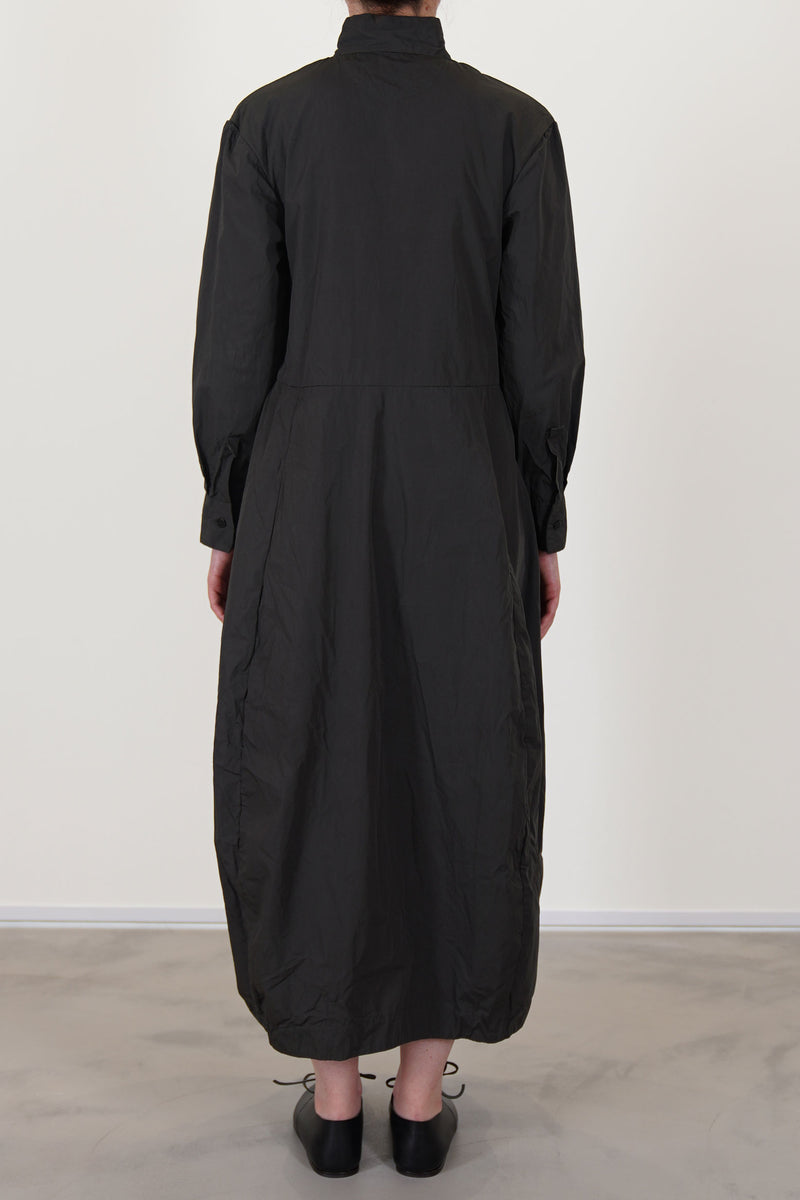 back view of bergfabel letty dress moss long sleeve dress with a stand collar detail, midi length and long sleeves with a button detail