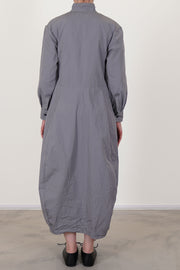back view of bergfabel letty dress fog with a slightly raised waist and a balloon style skirt with side pockets. unlined.