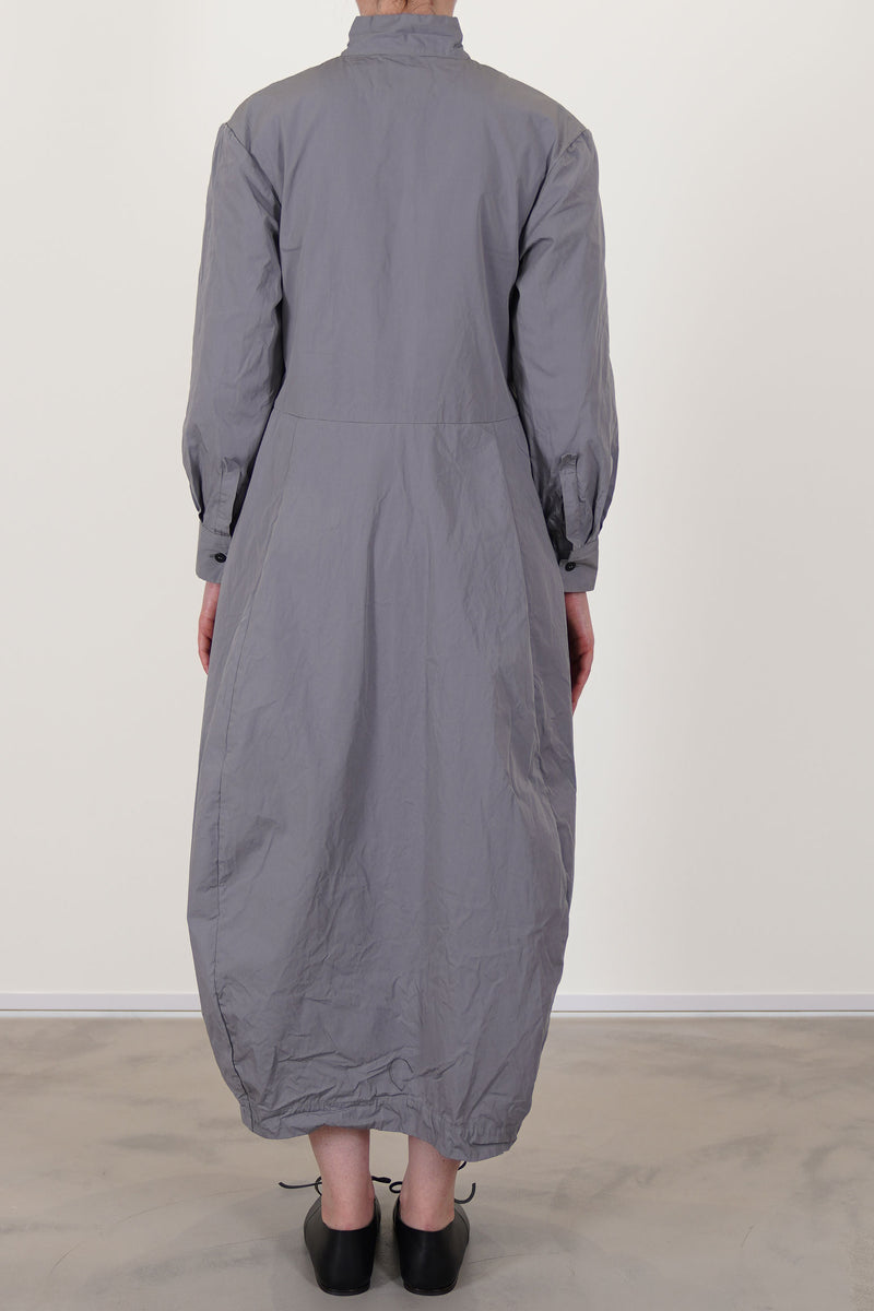 back view of bergfabel letty dress fog with a slightly raised waist and a balloon style skirt with side pockets. unlined.