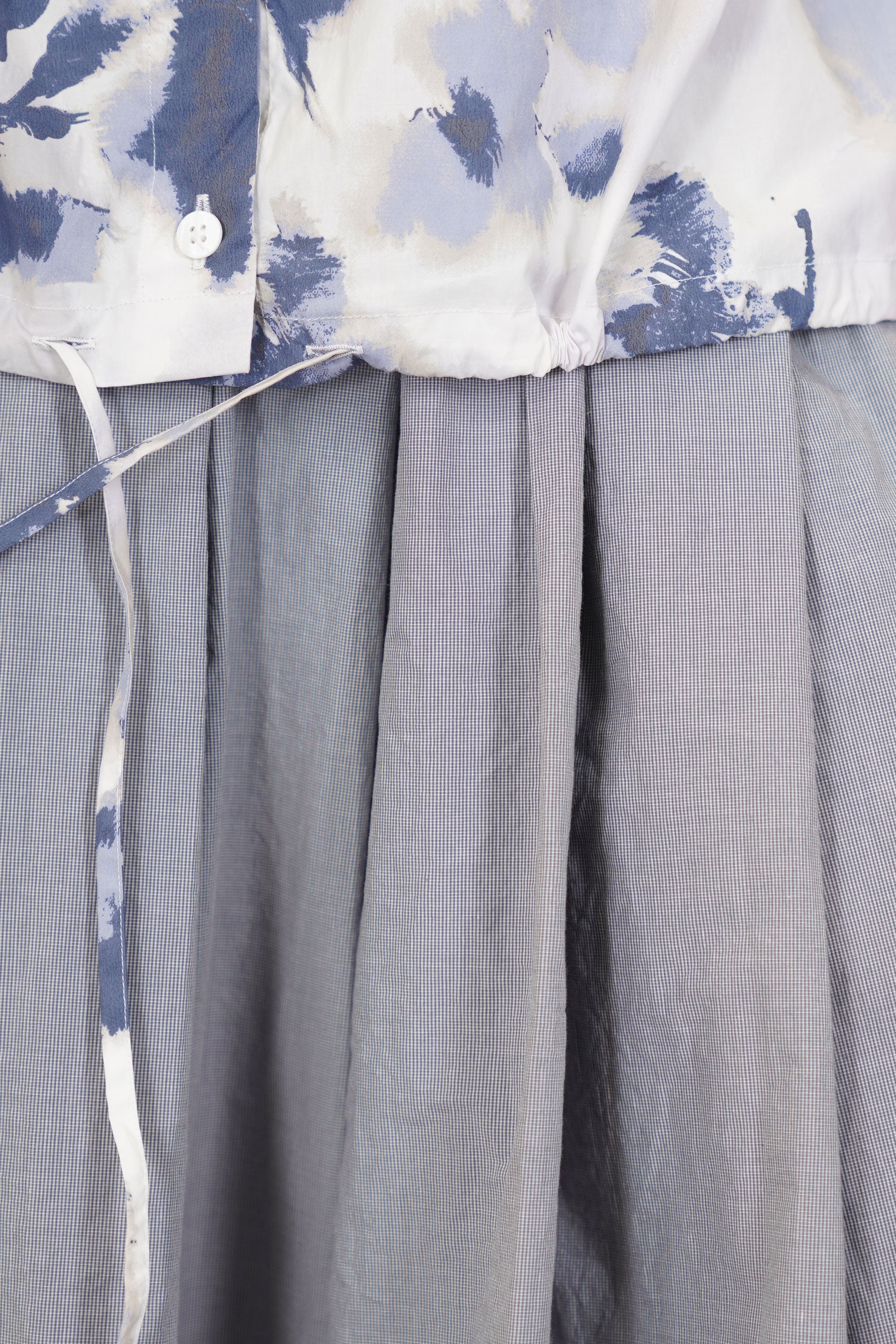 detail view of bergfabel alma shirt blooms strings at the hemline for a more personalised fit