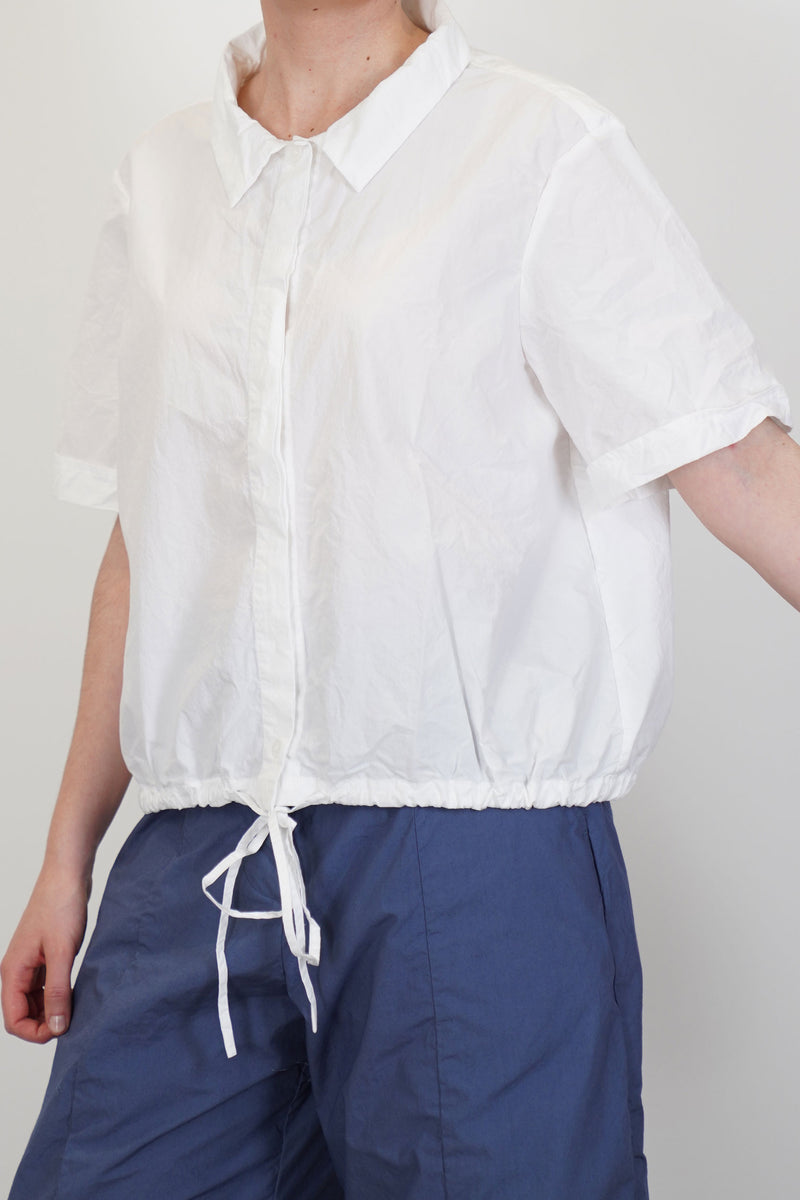 detail view of bergfabel alma shirt white slightly rolled up sleeve design