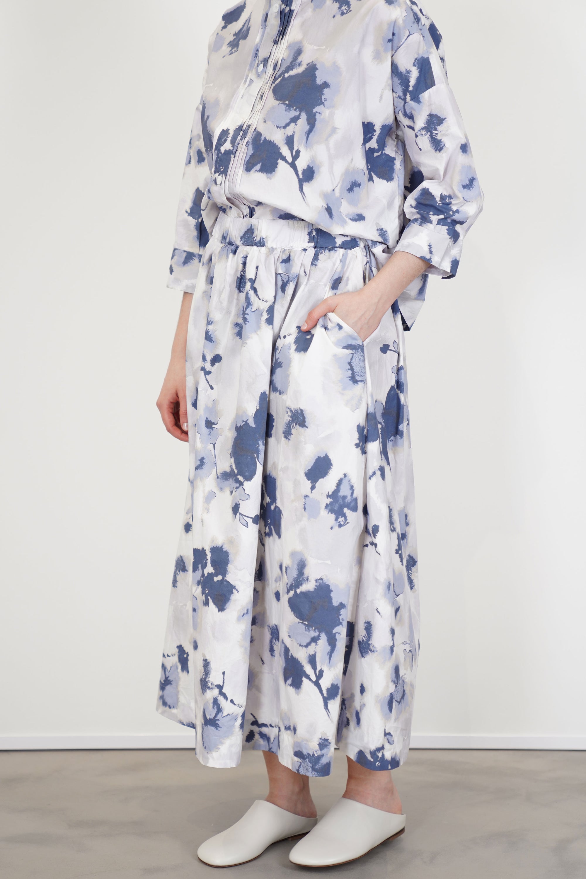 model wearing bergfabel ivy skirt blooms with matching blouse for a structural and distinct minimalist style