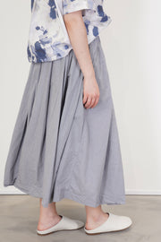 profile view of bergfabel matilde skirt charcoal check midi length and relaxed style