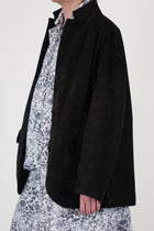 side view of bergfabel suede leather jacket bella deep brown dropped shoulders, a notched collar and oversized fit