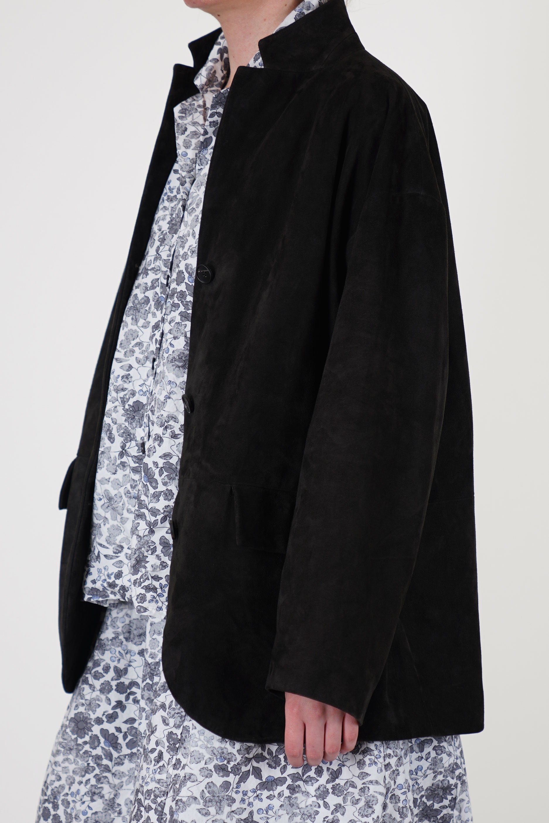 side view of bergfabel suede leather jacket bella deep brown dropped shoulders, a notched collar and oversized fit