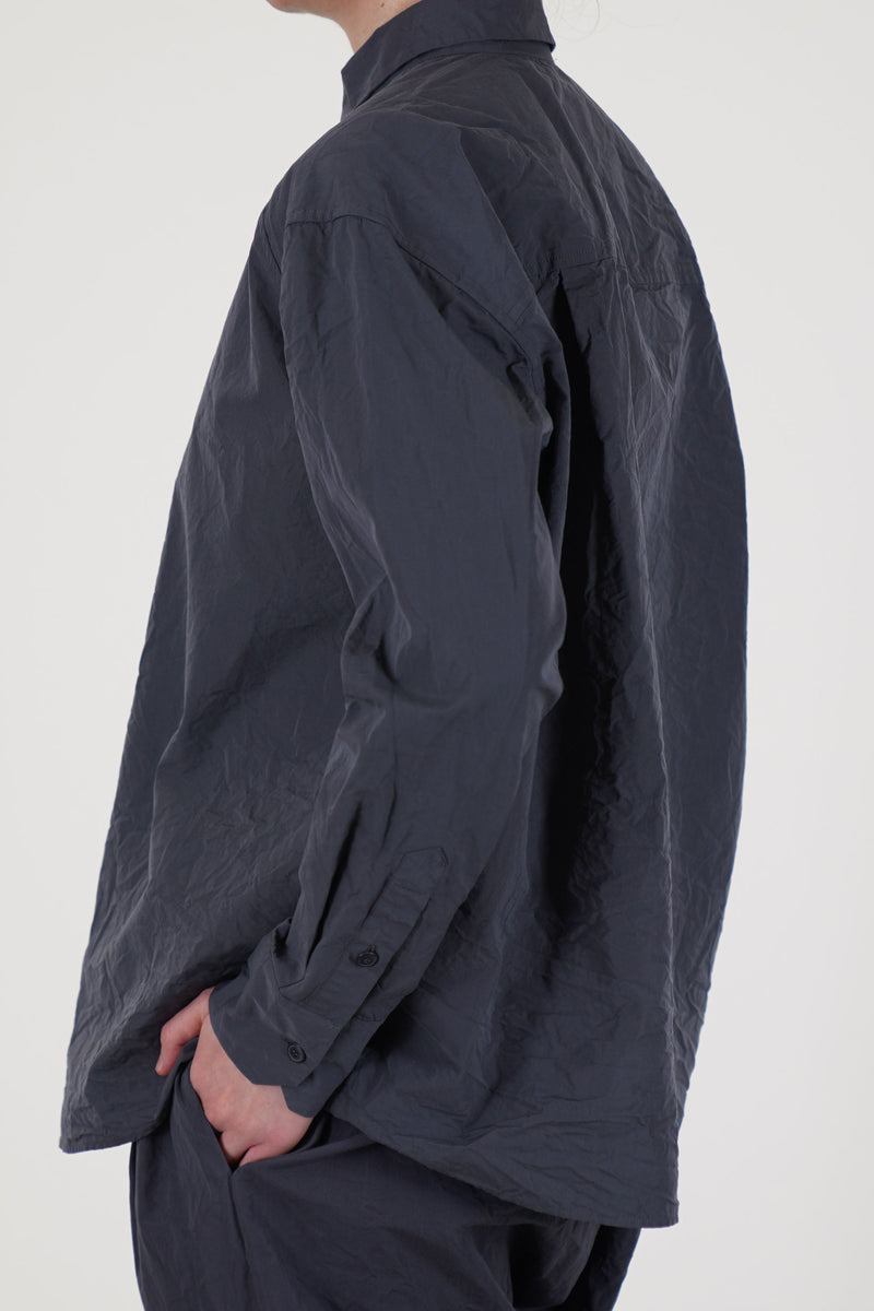 back view of casey casey drays shirt blu skull  its dropped shoulders offer a loose, flowing shape that suits both layered looks and standalone wear.
