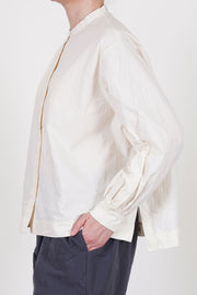 side view of casey casey biggy grandad shirt natural front button opening and voluminous fit