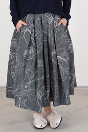 casey casey double rideaux skirt ikat grey  featuring an elasticated waistband with hidden adjustable drawstring, midi length, pleat details and side pockets.