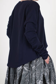 back view of casey casey seamless jumper cashmere night boat neckline and relaxed fit.