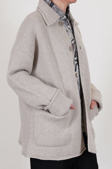 side view of casey casey jacket rove light grey wool relaxed knitted style with drop shoulders, loose fit and big patch pockets. 