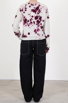 back view of casey casey paulo pant denim black featuring two back patch pockets and contrast stitching details