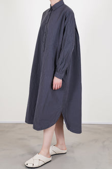 side view of casey casey yuki dress blu skull shirt dress style curved hemline, drop shoulders, slimmer fitted sleeves with gathered details at the cuffs.