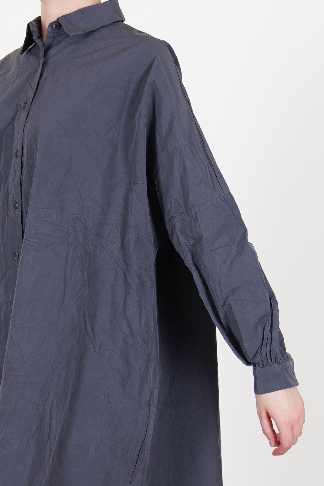 detail view of casey casey yuki dress blu skull drop shoulder and gathred details at the cuffs