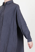 detail view of casey casey yuki dress blu skull drop shoulder and gathred details at the cuffs
