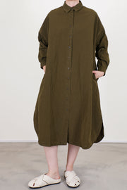 casey casey yuki dress green lake shirt dress style with a button front opening and long sleeves.