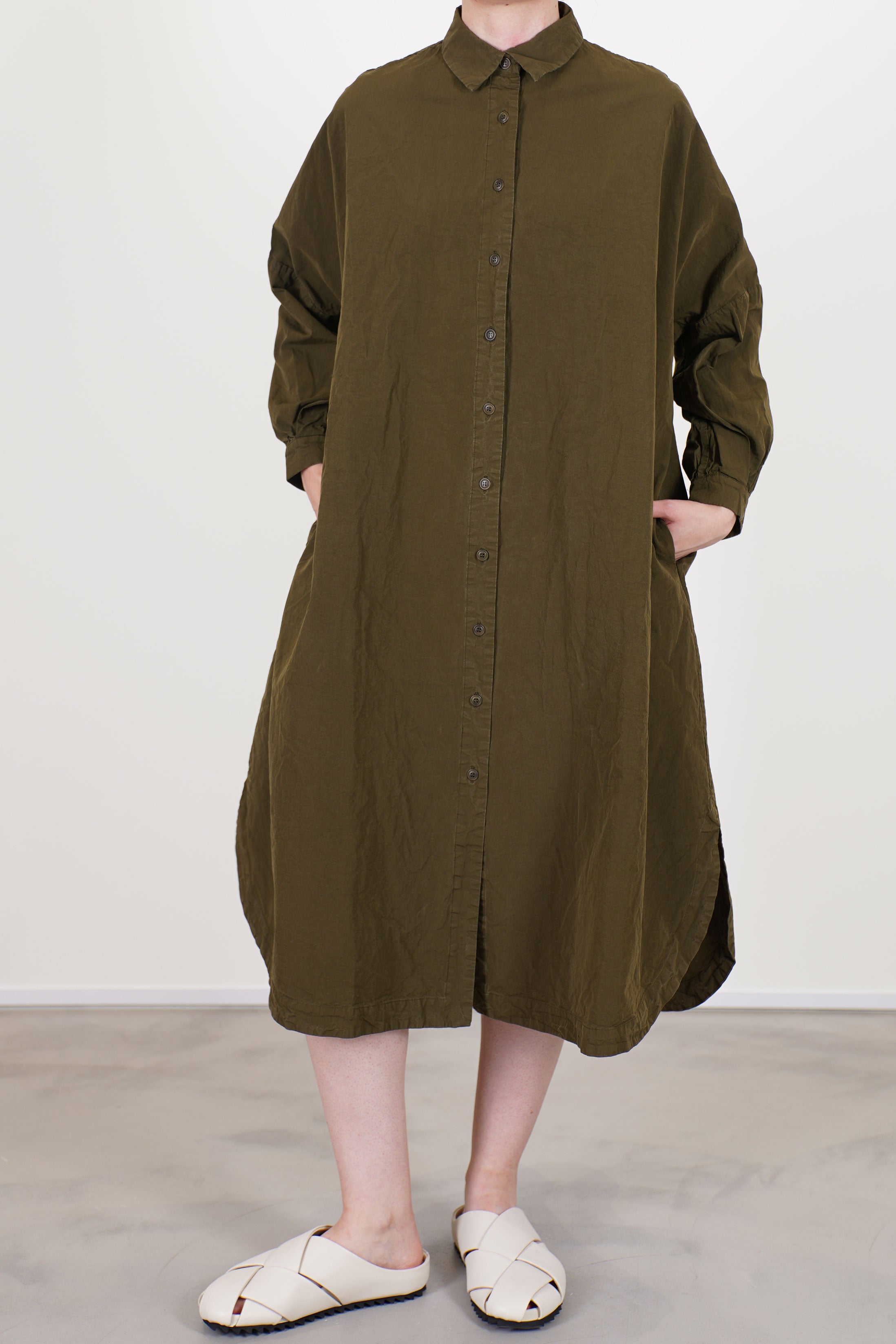 casey casey yuki dress green lake shirt dress style with a button front opening and long sleeves.
