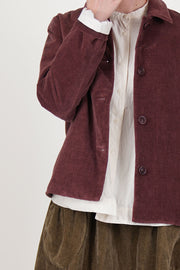 detail view of casey casey pwet jacket velvet prune front button opening and corozo button details