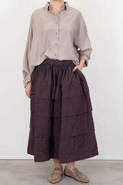 model wears casey casey horizon skirt wine 