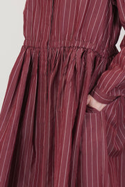 detail view of refined gathered details of casey casey panzy dress cotton silk wine