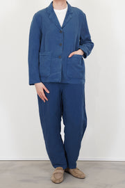 model wears casey casey workwear puddy jacket tuareg blue