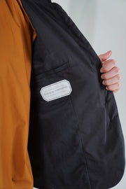 detail view of école de curiosités padded jacket jessica silk cotton black fully lined in soft cotton for added comfort.