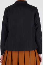 back view of école de curiosités padded jacket jessica silk cotton black narrow fit on the shoulders and short length