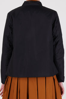 back view of école de curiosités padded jacket jessica silk cotton black narrow fit on the shoulders and short length