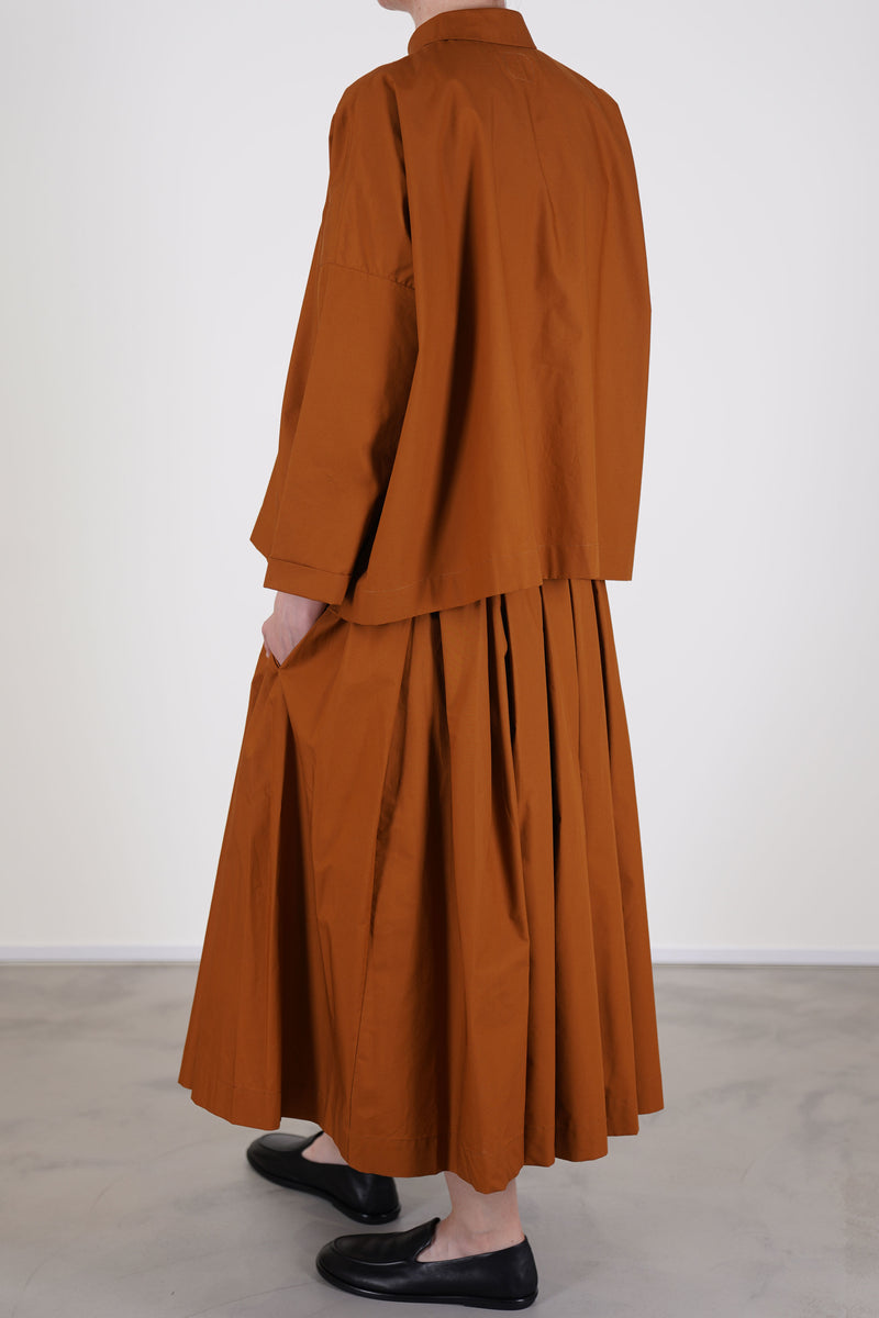 back view of école de curiosités shirt brigitte caramel brown boxy cut and worn with matching skirt solange in caramel brown