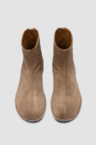 Close-up of Officine Creative suede boots showing handcrafted Italian construction, soft suede texture
