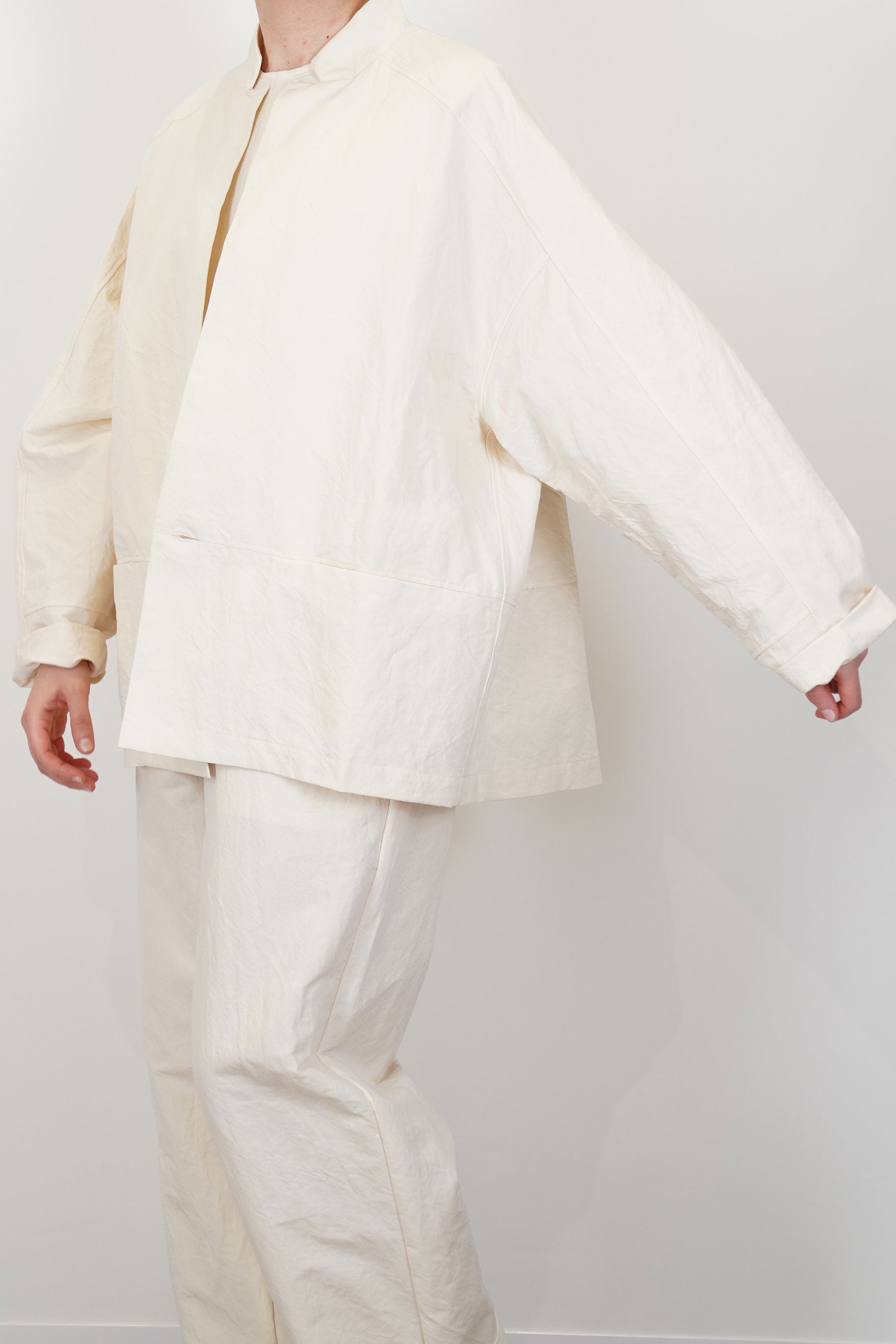profile view of oyuna absent paper jacket ivory oversized silhouette