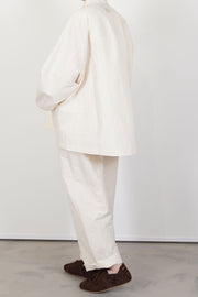 profile view of oyuna absent paper jacket ivory structural design