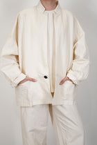 front detail view of oyuna absent paper jacket ivory