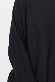 close up view of oyuna bagi pullover cashmere black moss stitching technique