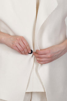 close up view of oyuna moon jacket cashmere ivory front button detail