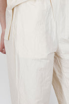close up view of passage paper trousers ivory crisp material