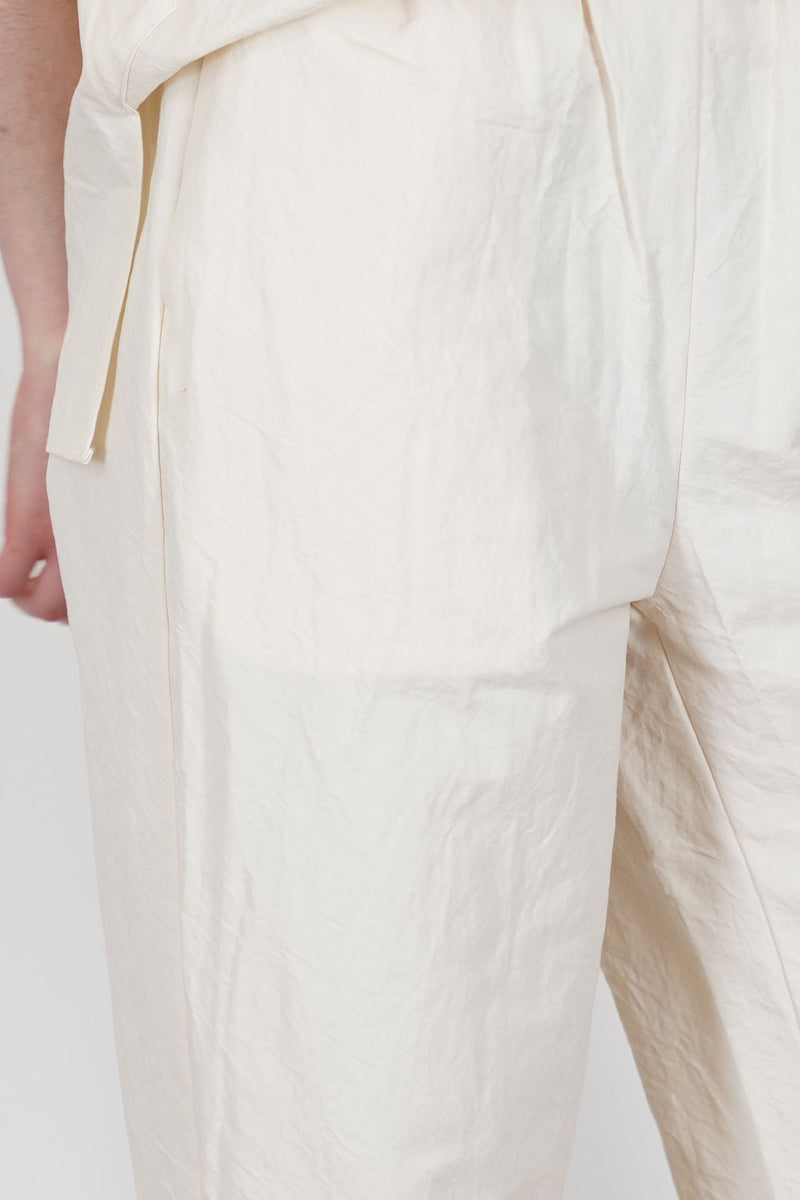 close up view of passage paper trousers ivory crisp material