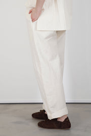 profile view of passage paper trousers ivory  tapered leg